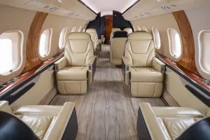 Forward cabin interior view of Global XRS S/N 9234 looking towards the cockpit, showing crew rest area and galley entrance