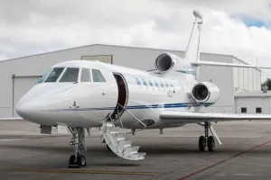 Inviting view of the 2002 Falcon 50EX exterior with the airstair deployed, ready for passenger boarding